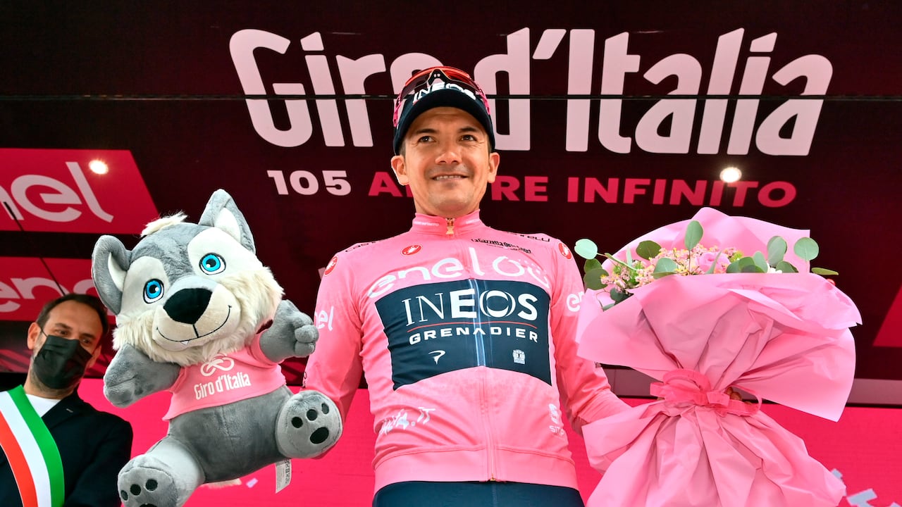 Ecuador's Richard Carapaz wears the pink jersey of the overall leader as he celebrates on podium after completing the 18th stage of the Giro D'Italia cycling race, from Borgo Valsugana to Treviso, Italy, Thursday, May 26, 2022. (Massimo Paolone/LaPresse via AP)