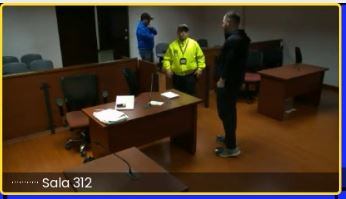 John Poulos ante un juez de control de garantías.