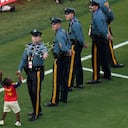 Spain's Lamine Yamal's brother, Keyne, plays with a police officer after the World Cup final soccer match against Argentina in East Rutherford, N.J., near New York, Sunday, July 19, 2026. (AP Photo/Seth Wenig)