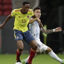 Argentina's Lautaro Martinez, right, and Colombia's Yerry Mina battle for the ball during a Copa America semifinal soccer match at the National stadium in Brasilia, Brazil, Tuesday, July 6, 2021. (AP Photo/Eraldo Peres)