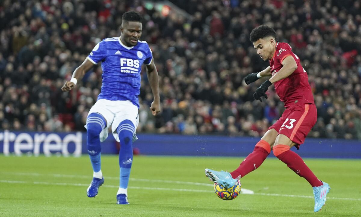 Liverpool's Luis Diaz, right, challenges for the ball with Leicester's Daniel Amartey during the English Premier League soccer match between Liverpool and Leicester City at Anfield stadium in Liverpool, England, Thursday, Feb. 10, 2022. (AP/Jon Super)