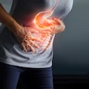 Woman touching stomach painful suffering from stomachache causes of menstruation period, gastric ulcer, appendicitis or gastrointestinal system disease. Healthcare and health insurance concept.