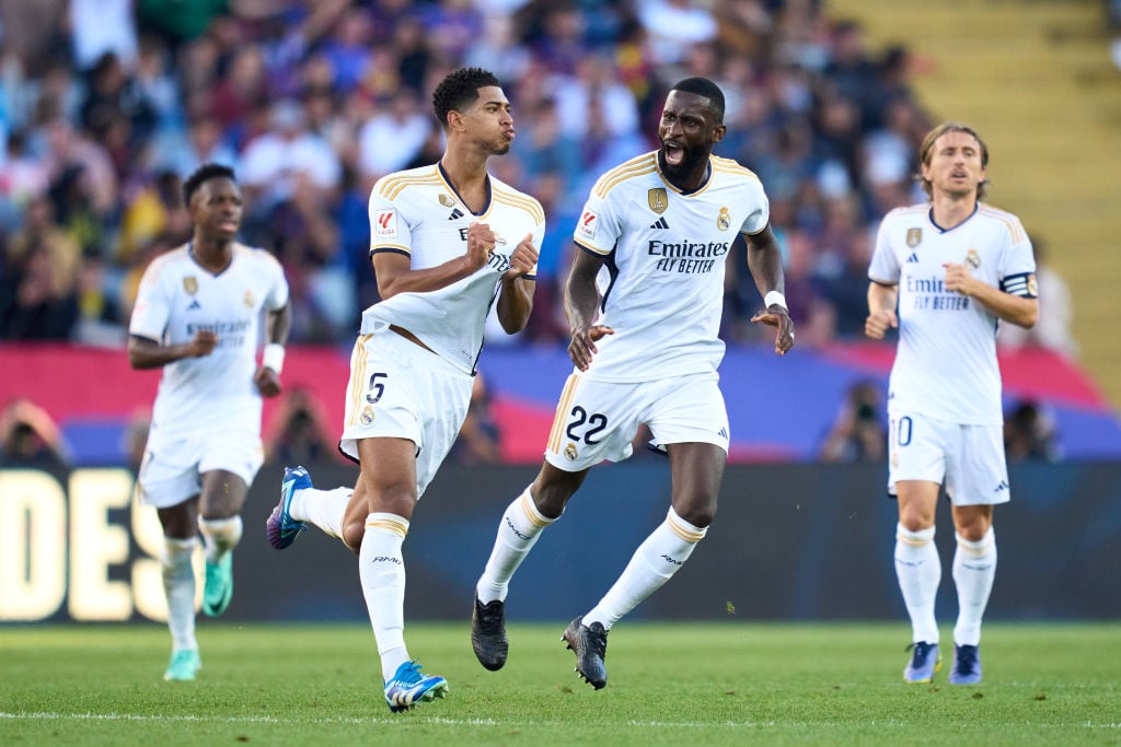 BARCELONA, SPAIN - OCTOBER 28: Jude Bellingham of Real Madrid CF celebrates with his teammate Antonio Rudiger after scoring the team's first goal during the LaLiga EA Sports match between FC Barcelona and Real Madrid CF at Estadi Olimpic Lluis Companys on October 28, 2023 in Barcelona, Spain. (Photo by Alex Caparros/Getty Images)