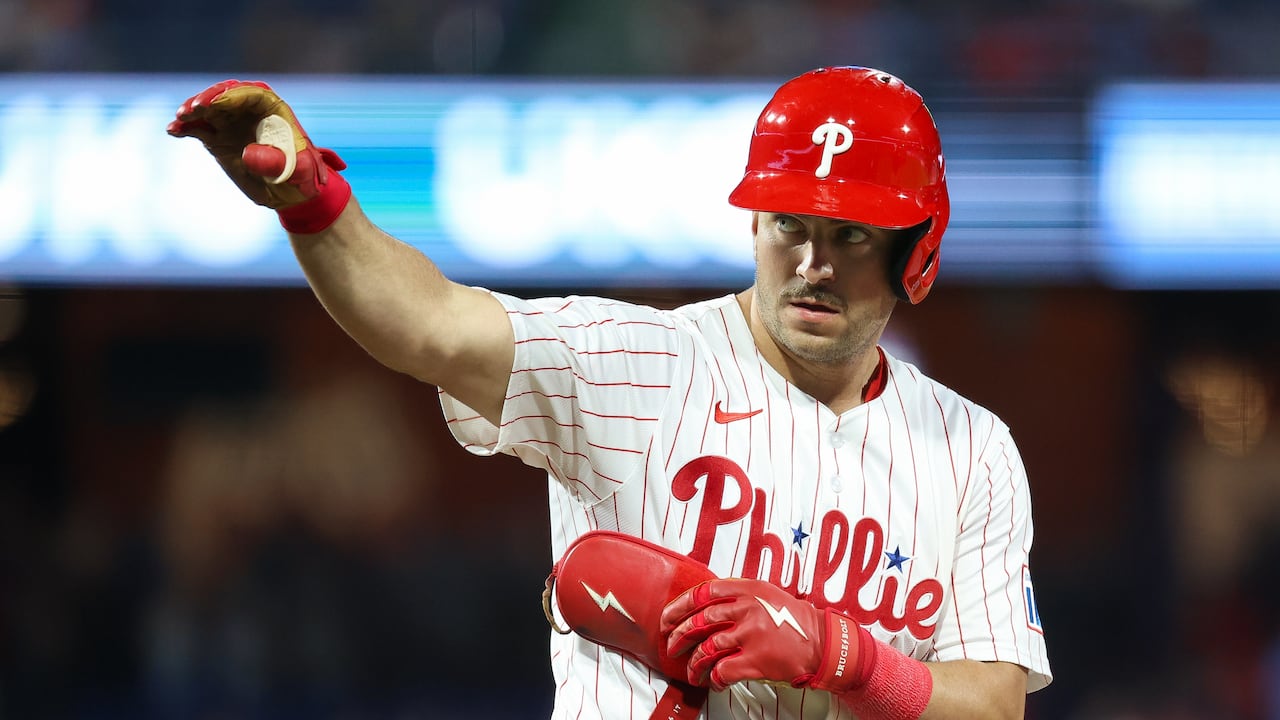 PHILADELPHIA, PENNSYLVANIA - SEPTEMBER 10: Otto Kemp #4 of the Philadelphia Phillies waves after reaching first base on a single to right field during the eighth inning against the New York Mets at Citizens Bank Park on September 10, 2025 in Philadelphia, Pennsylvania. (Photo by Isaiah Vazquez/Getty Images)