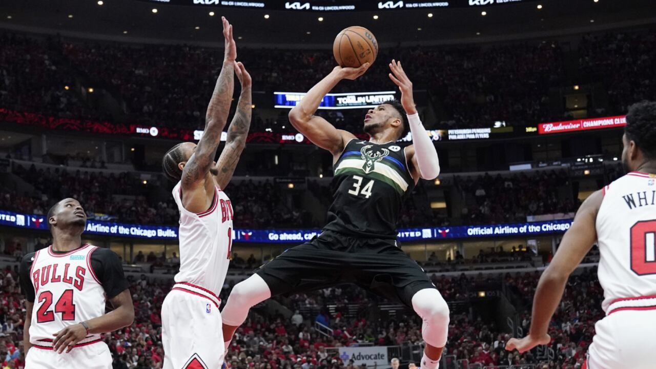 Milwaukee Bucks forward Giannis Antetokounmpo (34) shoots against Chicago Bulls forward DeMar DeRozan during the second half of Game 4 of a first-round NBA basketball playoff series Sunday, April 24, 2022, in Chicago. The Bucks won 119-95. (AP/Nam Y. Huh)