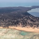 NOMUKA, TONGA - JANUARY 17: In this handout photo provided by the New Zealand Defense Force, an aerial view from a P-3K2 Orion surveillance flight of heavy ash fall on January 17, 2022 Nomuka, Tonga. A 5 Squadron crew work on board whilst flying overhead to provide vital information to send back to MFAT and various other government agencies. Tonga was struck by a tsunami caused by an undersea volcano erupting in the Pacific Ocean on January 15th. (Photo by New Zealand Defense Force via Getty Images)