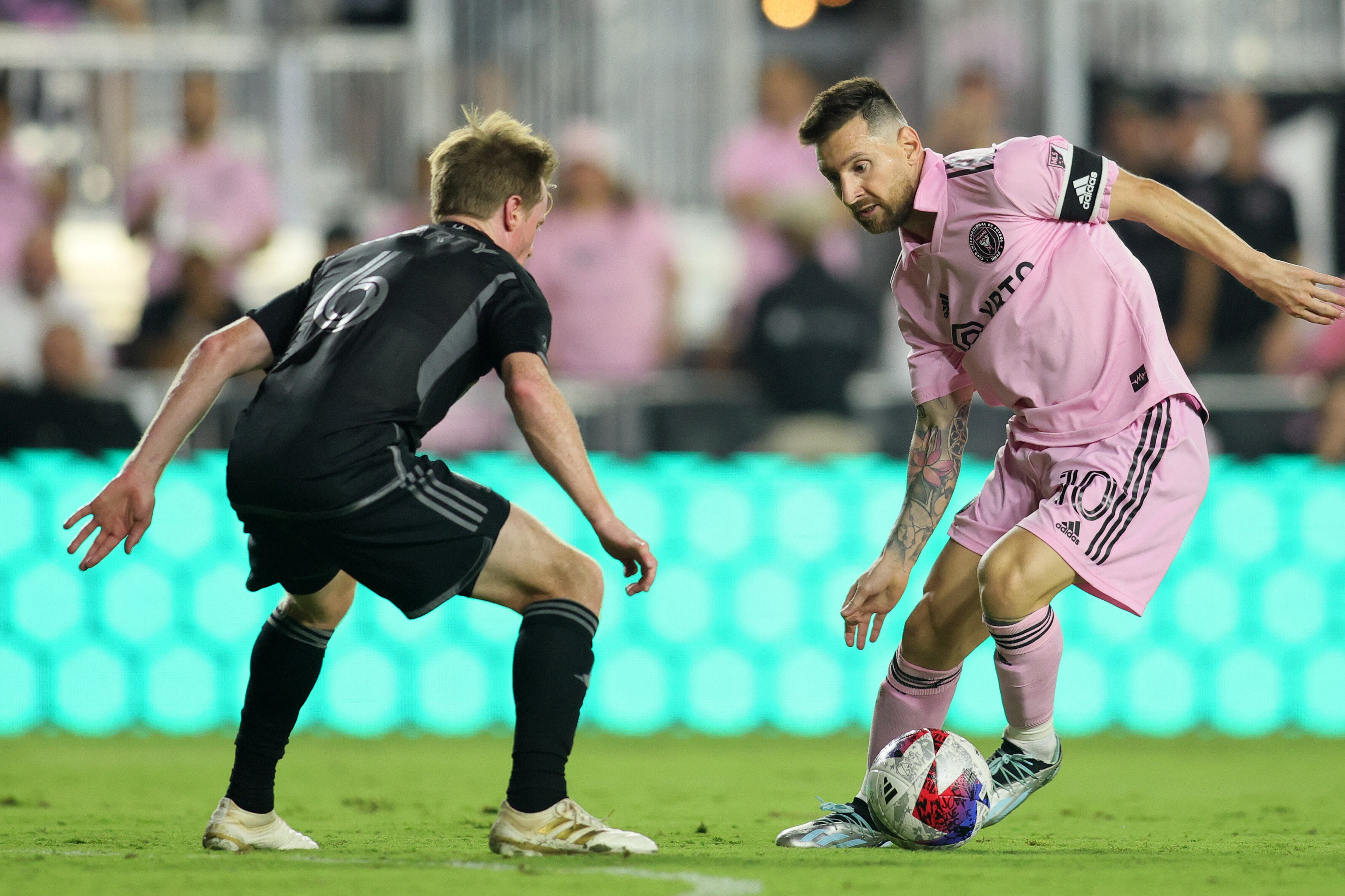 Aug 30, 2023; Fort Lauderdale, Florida, USA; Inter Miami forward Lionel Messi (10) kicks the ball past Nashville SC midfielder Dax McCarty (6) during the second half at DRV PNK Stadium. Mandatory Credit: Sam Navarro-USA TODAY Sports