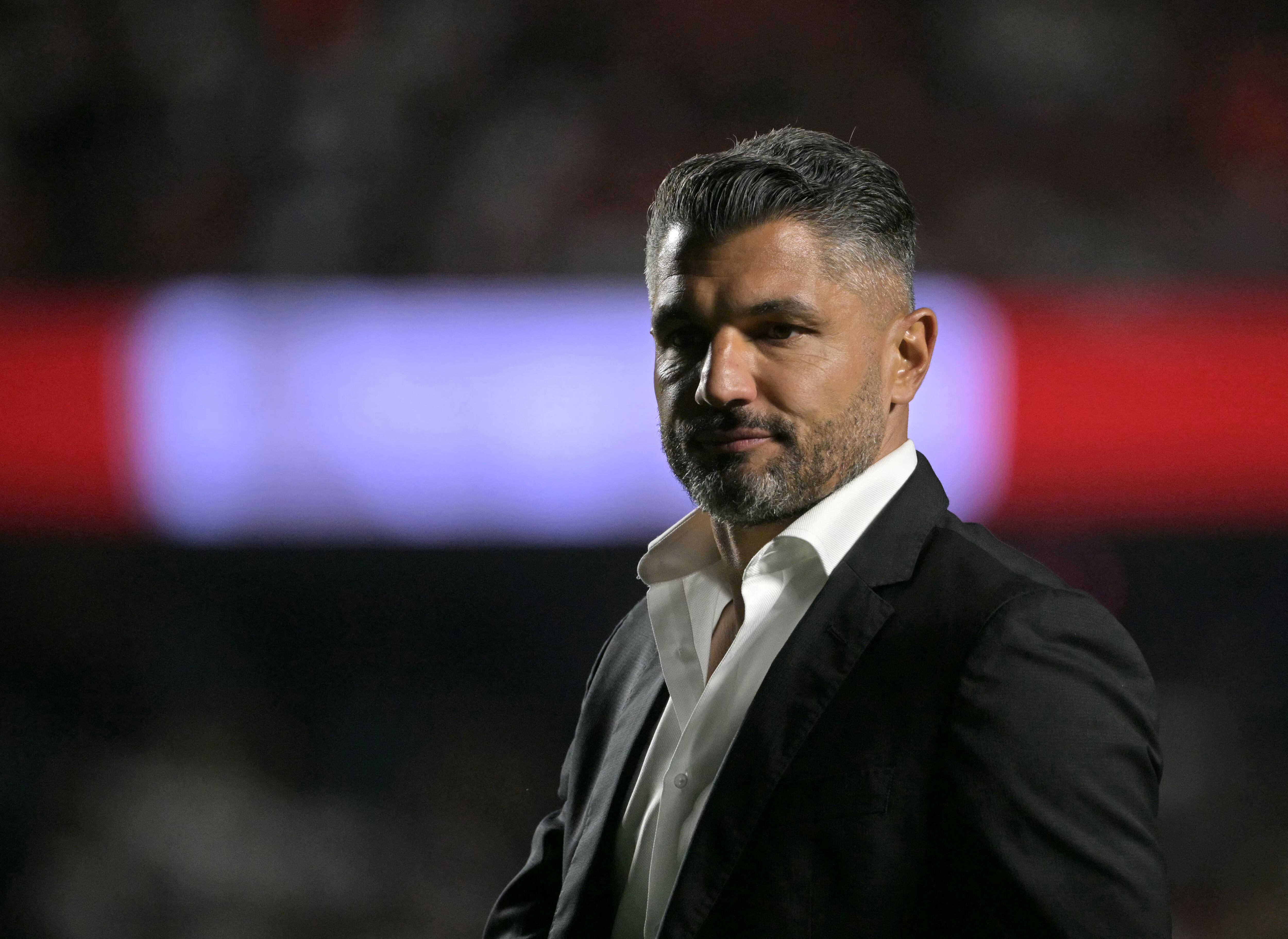 Atletico Nacional's Argentine head coach Javier Gandolfi gestures during the Copa Libertadores round of 16 second leg football match between Brazil's Sao Paulo and Colombia's Atletico Nacional at the Morumbi Stadium in Sao Paulo, Brazil on August 19, 2025. (Photo by NELSON ALMEIDA / AFP)