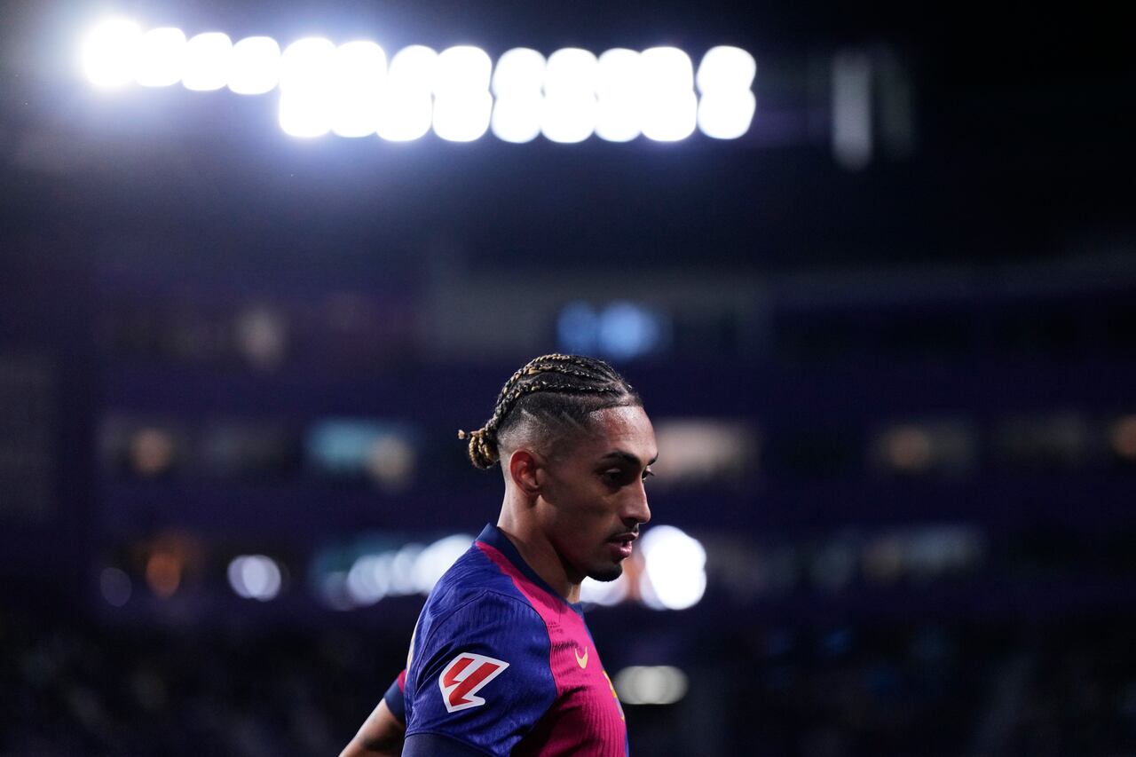 Barcelona's Raphinha runs during the Spanish La Liga soccer match between Valladolid and FC Barcelona at the Jose Zorrilla stadium in Valladolid, Spain, Saturday, May 3, 2025. (AP Photo/Manu Fernandez)