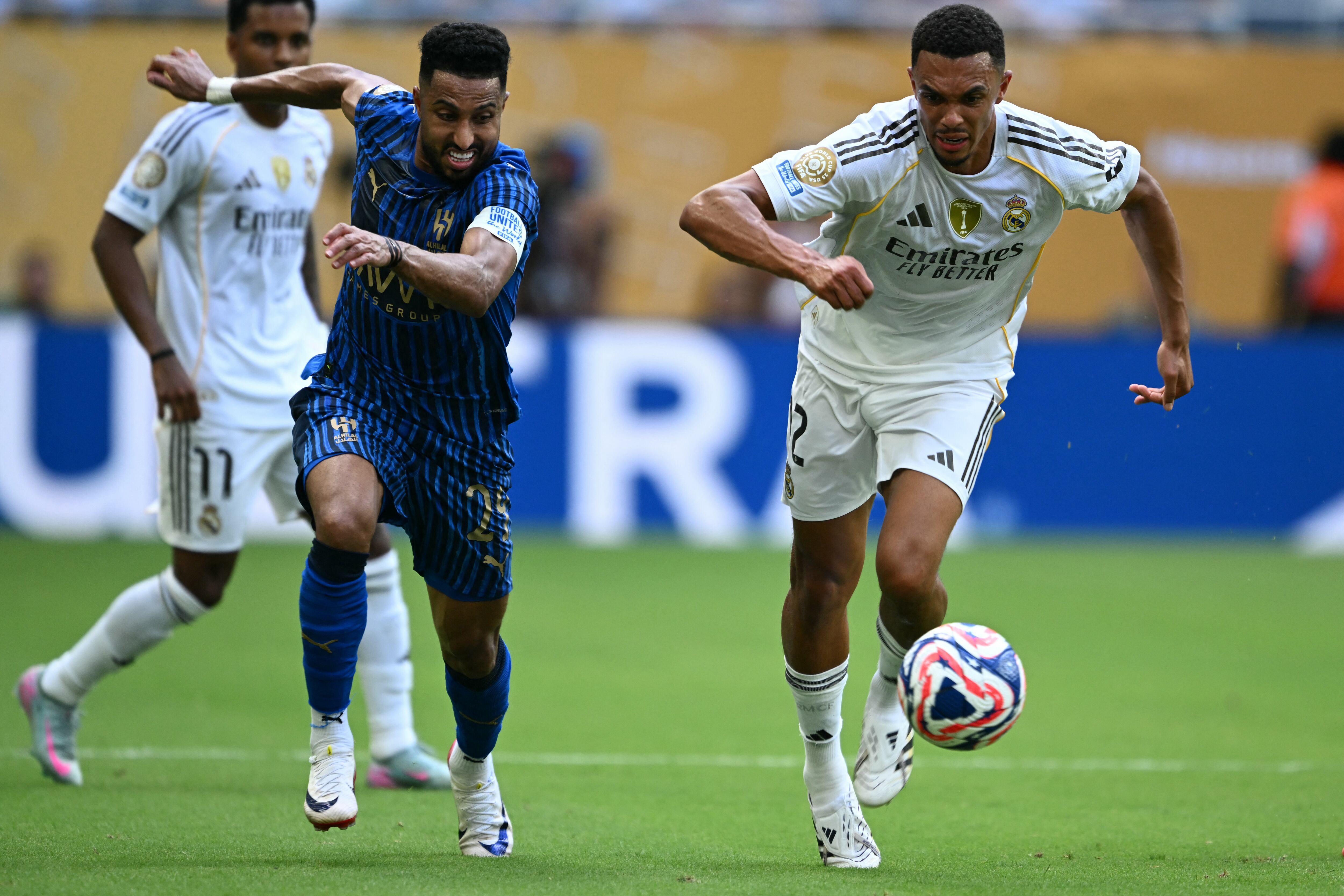 Al Hilal's Saudi midfielder #29 Salem Al-Dawsari (L) fights for the ball with Real Madrid's English defender #12 Trent Alexander-Arnold during the FIFA Club World Cup 2025 Group H football match between Spain's Real Madrid and Saudi's Al-Hilal at the Hard Rock stadium in Miami on June 18, 2025. (Photo by CHANDAN KHANNA / AFP)