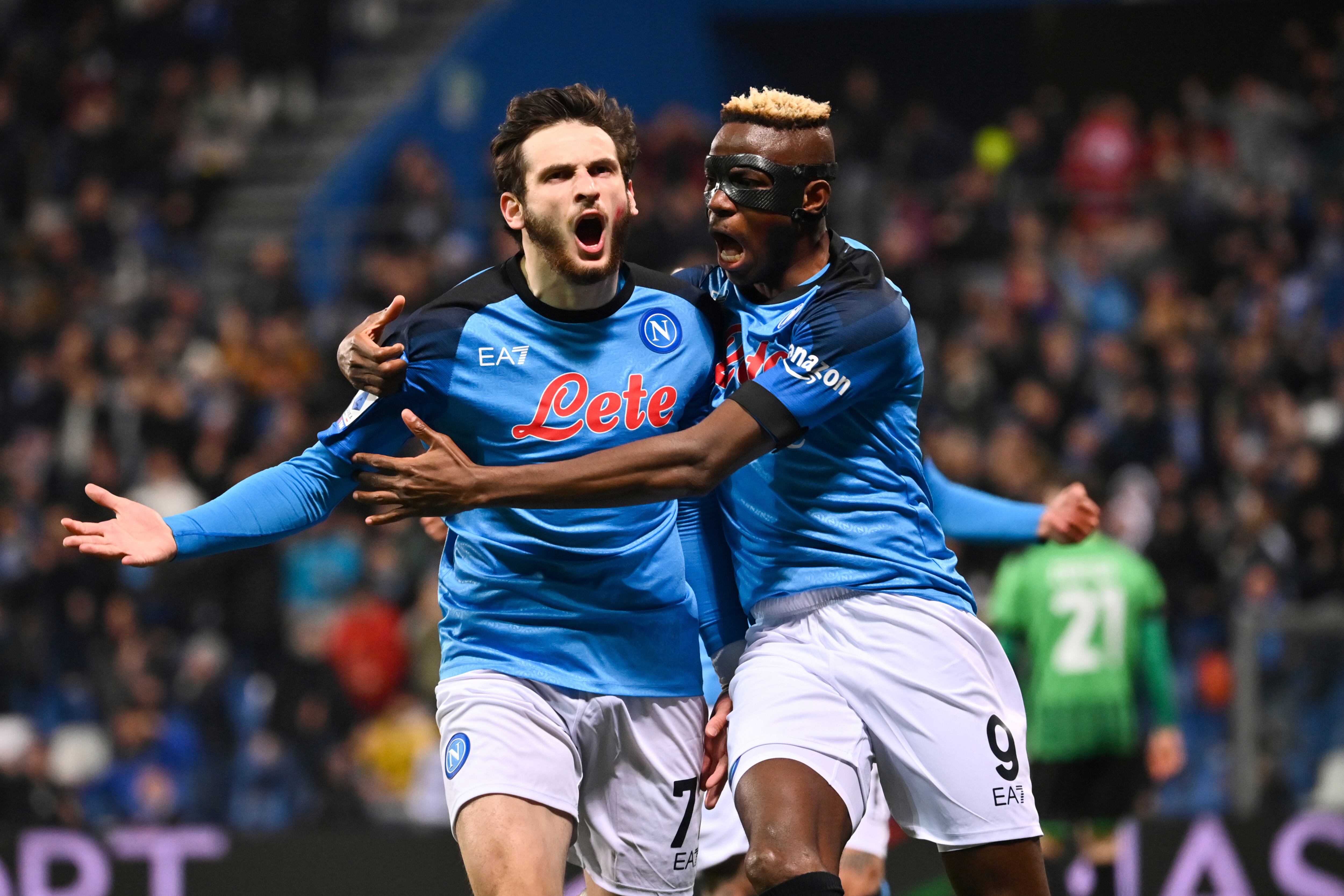 Napoli's Khvicha Kvaratskhelia, left, celebrates with team mate Victor Asimhen after scoring to 0-1 during the Serie A soccer match between Sassuolo and Napoli, at the Mapei Stadium in Reggio Emilia, Italy, Friday Feb. 17, 2023. (Massimo Paolone/LaPresse via AP)