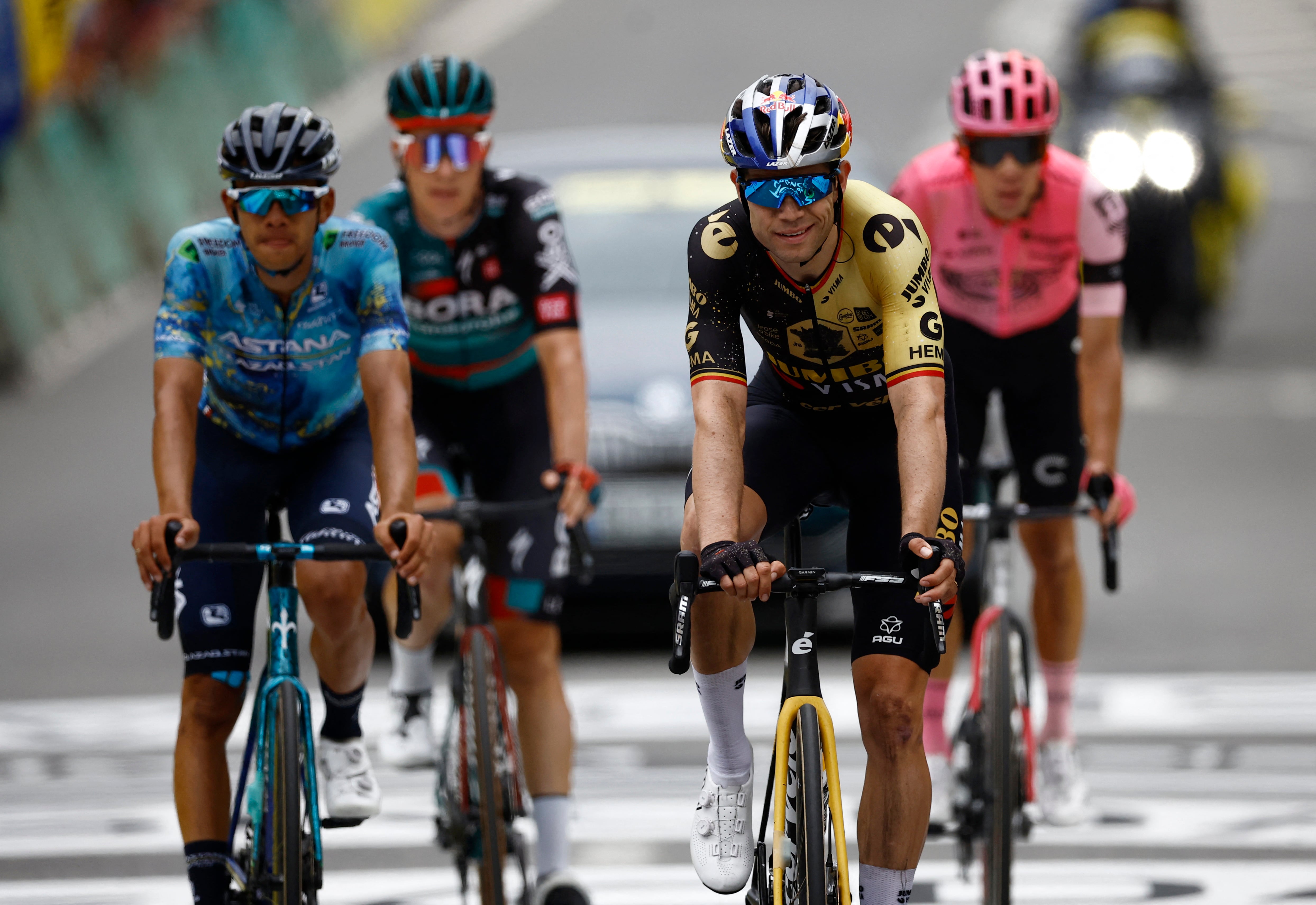Cycling - Tour de France - Stage 5 - Pau to Laruns - France - July 5, 2023 Team Jumbo–Visma's Wout van Aert crosses the finish line with riders after stage 5 REUTERS/Stephane Mahe