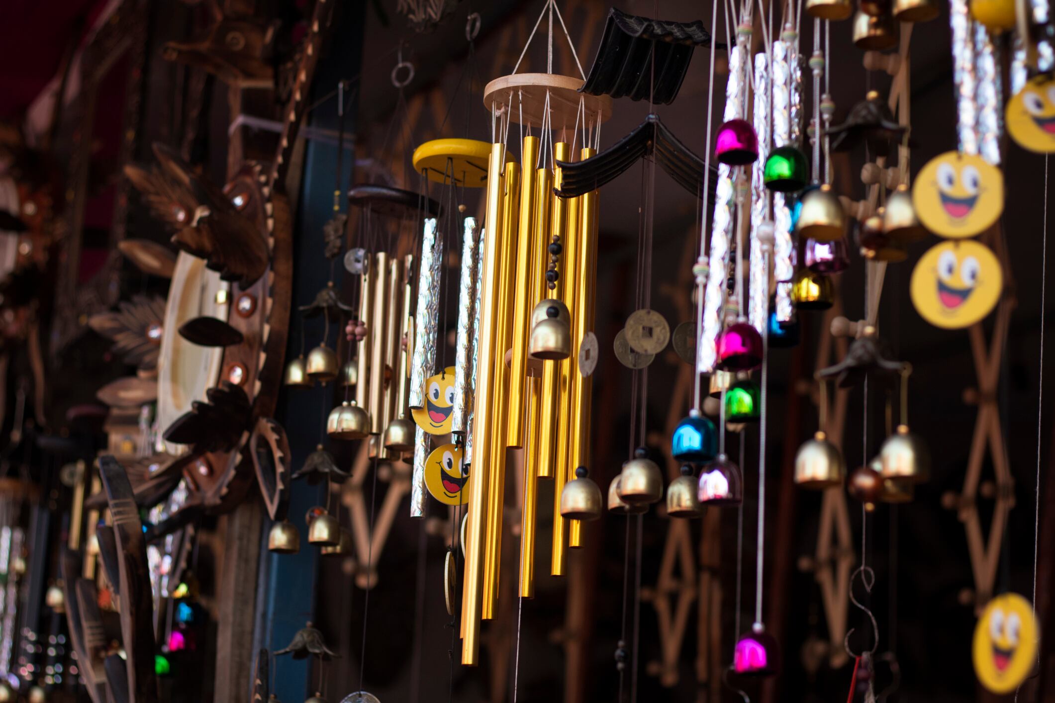 Beautiful Wind Chimes and handmade wooden crafts Hanging For Sale in a flea market.