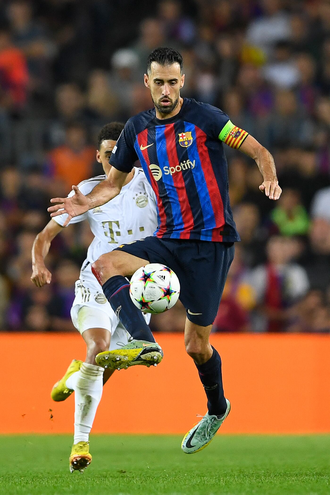 (FILES) Barcelona's Spanish midfielder Sergio Busquets controls the ball during the UEFA Champions League 1st round day 5, Group C football match between FC Barcelona and FC Bayern Munich at the Camp Nou stadium in Barcelona on October 26, 2022. Sergio Busquets will leave Barcelona in June at the end of his contract, the midfielder confirmed on May 9, 2023 ending a highly successful era at the club. The 34-year-old was a central figure in Barcelona's golden era winning a host of trophies including the Champions League three times. (Photo by Pau BARRENA / AFP)