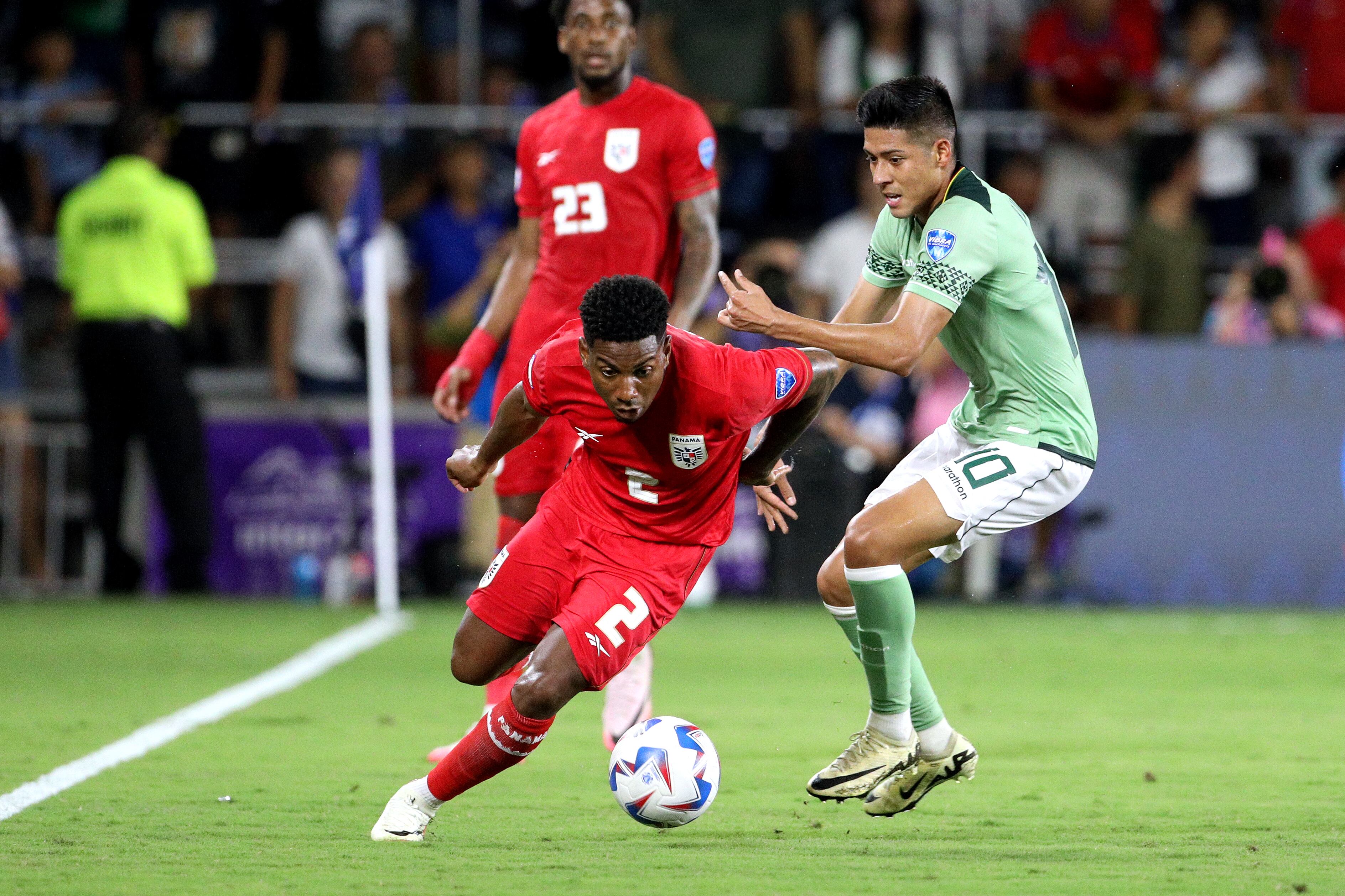 Panama's defender #02 Cesar Blackman fights for the ball with Bolivia's midfielder #10 Ramiro Vaca during the Conmebol 2024 Copa America tournament group C football match between Bolivia and Panama at Inter&Co Stadium in Orlando, Forida on July 1, 2024. (Photo by Gregg NEWTON / AFP)