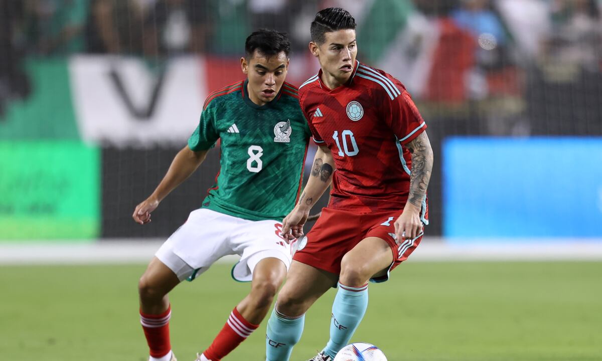 SANTA CLARA, CA - SEPTEMBER 27: James Rodríguez of Colombia and Carlos Rodriguez of Mexico battle for the ball during the friendly match between Mexico and Colombia at Levi's Stadium on September 27, 2022 in Santa Clara, California. (Photo by Omar Vega/Getty Images)