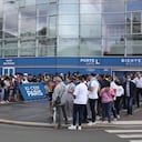Paris Saint-Germain supporters wait outside the Parc des Princes stadium in Paris, Monday, Aug. 9, 2021 in Paris. Argentine's soccer star Lionel Messi could become the latest star to help Paris Saint-Germain in its quest to win the elusive Champions League. (AP Photo/Rafael Yaghobzadeh)