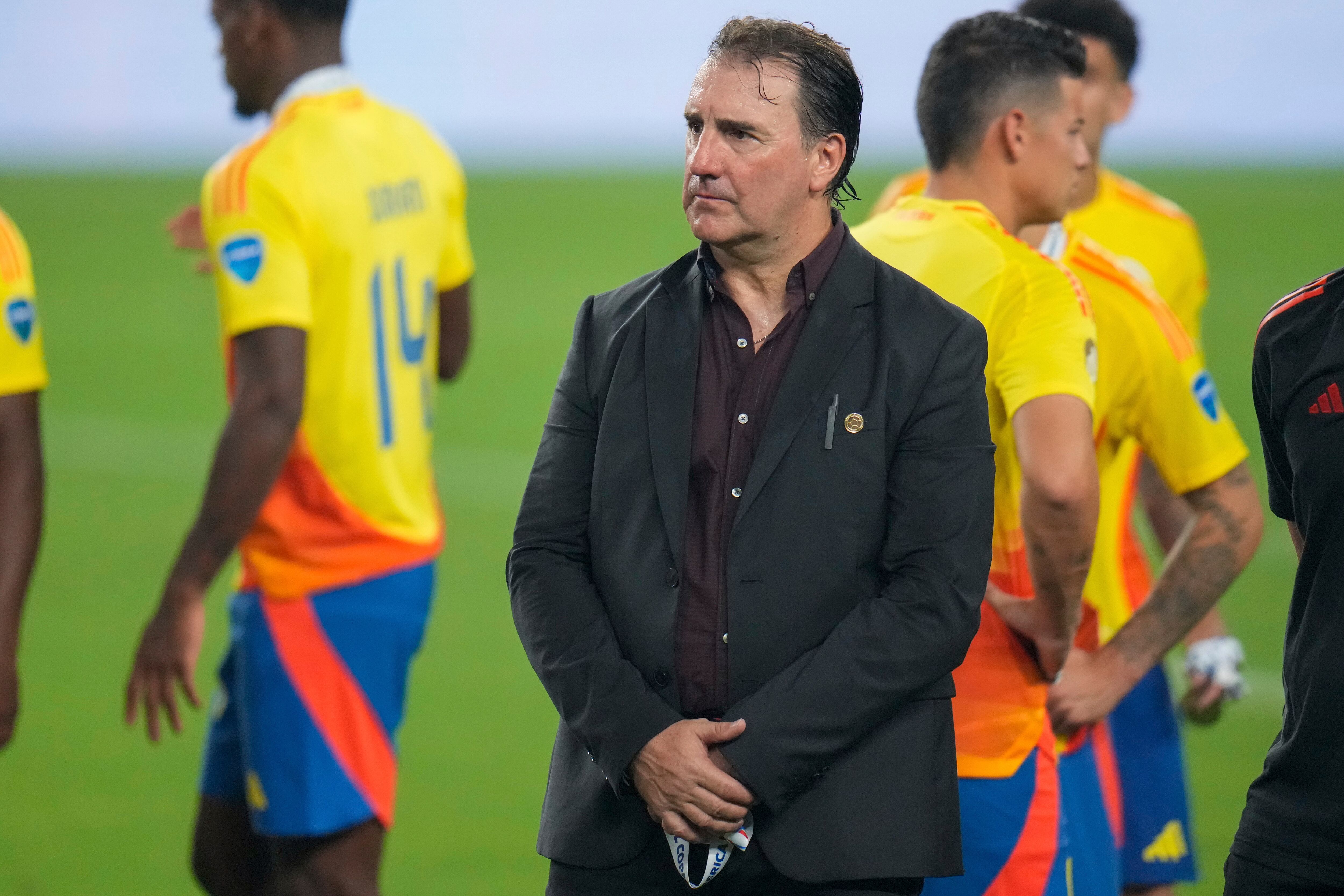 Colombia's coach Nestor Lorenzo stands during the award ceremony after his team lost to Argentina the Copa America final soccer match in Miami Gardens, Fla., Monday, July 15, 2024. (AP Photo/Julio Cortez)