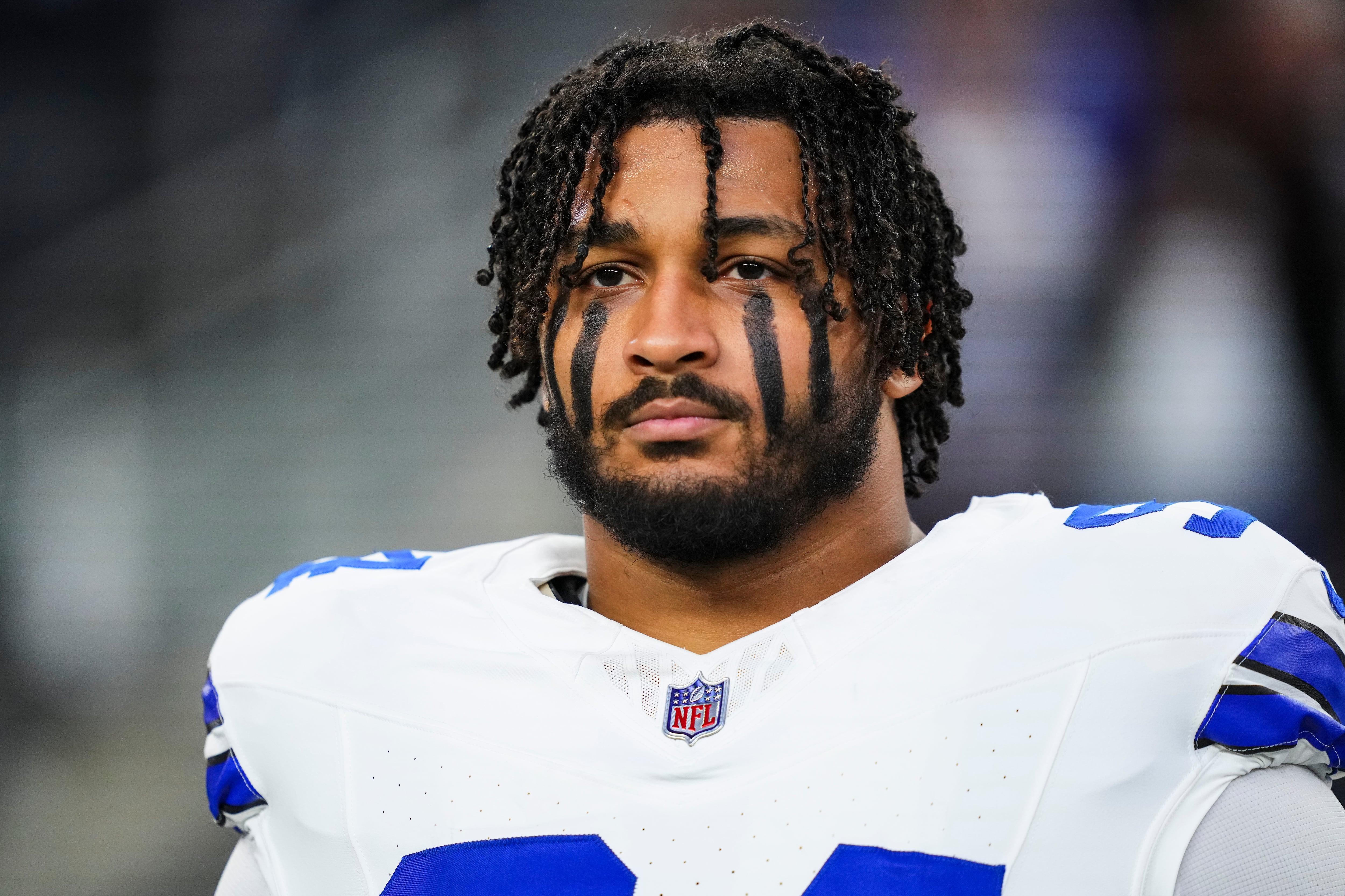 ARLINGTON, TX - DECEMBER 22: Marshawn Kneeland #94 of the Dallas Cowboys looks on from the sideline during the national anthem prior to an NFL football game against the Tampa Bay Buccaneers at AT&T Stadium on December 22, 2024 in Arlington, Texas. (Photo by Cooper Neill/Getty Images)