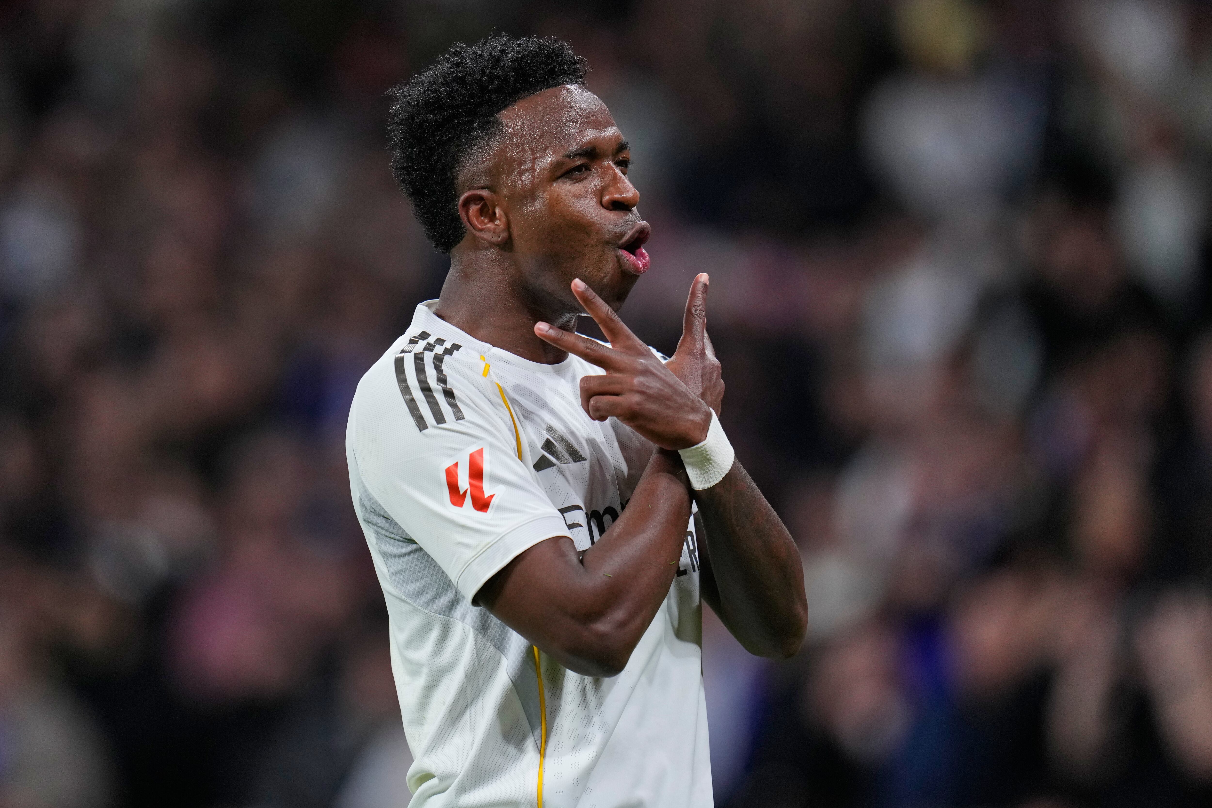 Real Madrid's Vinicius Junior celebrates scoring his side's 2nd goal from the penalty spot during the Spanish La Liga soccer match between Real Madrid and Real Sociedad in Madrid, Spain, Saturday, Feb. 14, 2026. (AP Photo/Manu Fernandez)