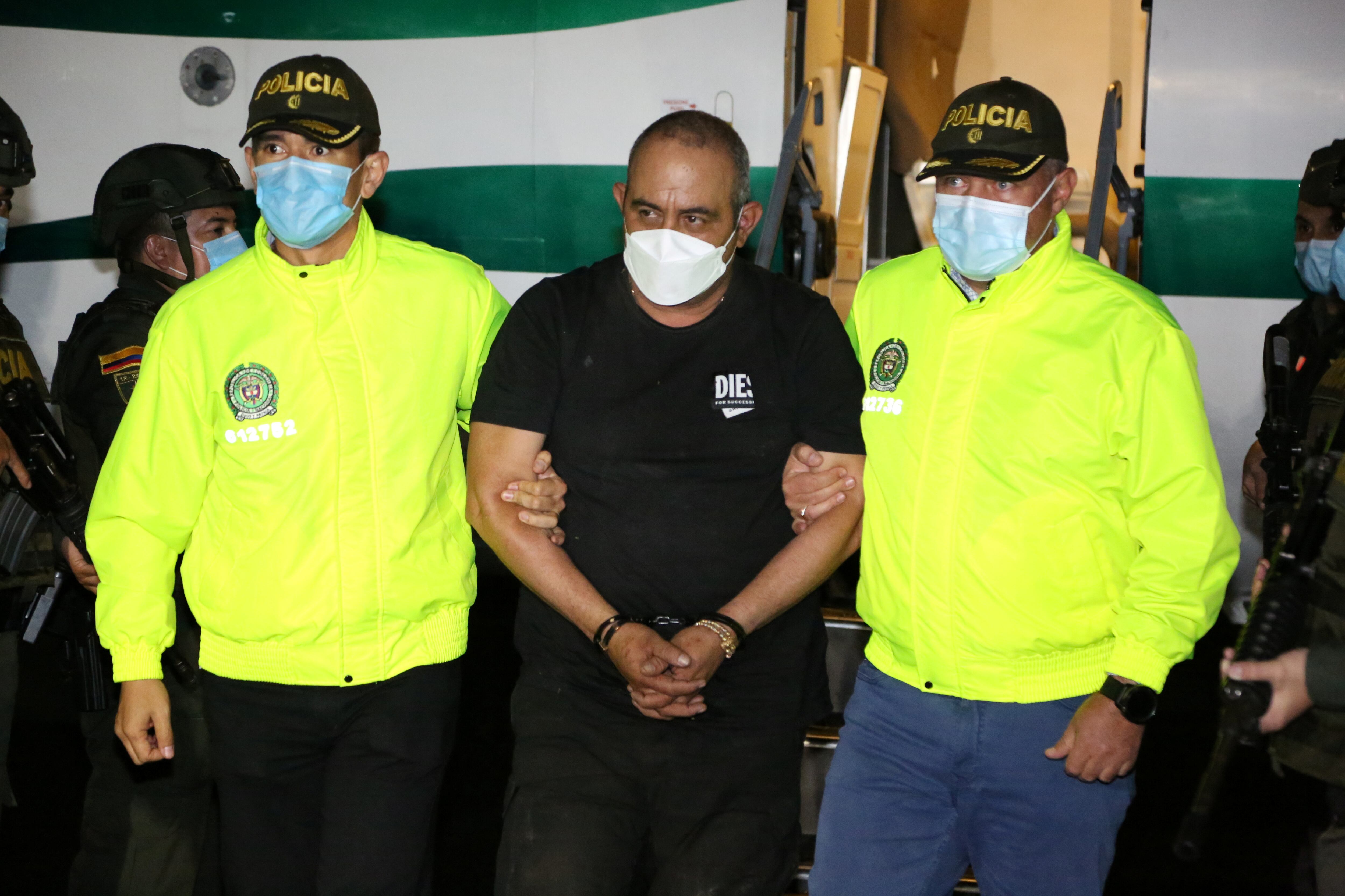 Dairo Antonio Usuga David, alias "Otoniel", top leader of the Gulf clan, is escorted by Colombian military after being captured, in Turbo