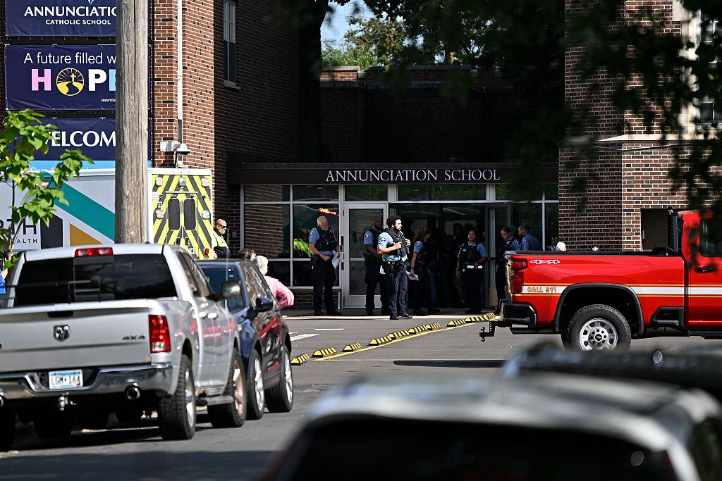MINNEAPOLIS, MINNESOTA - AUGUST 27: Police work the scene following a mass shooting at Annunciation Catholic School on August 27, 2025 in Minneapolis, Minnesota. According to Minneapolis Police, a gunman fired through the windows of the Annunciation Church at worshippers sitting in pews during a Catholic school Mass, killing two children and injuring at least 17 others. The gunman reportedly died at the scene from a self-inflicted gunshot wound. (Photo by Stephen Maturen/Getty Images)