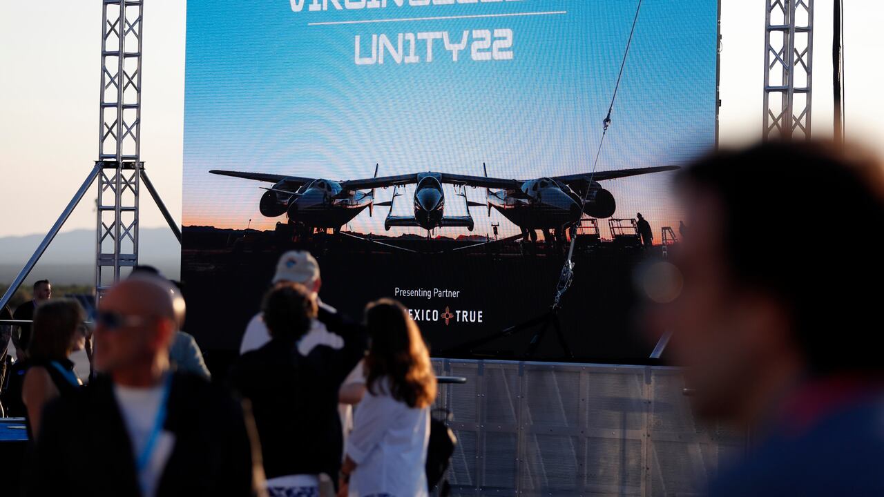 Special guests chat as they wait for Virgin Galactic founder Richard Branson's launch to space aboard his own rocket ship near Truth or Consequences, New Mexico, Sunday, July 11, 2021. (AP Photo/Andres Leighton)