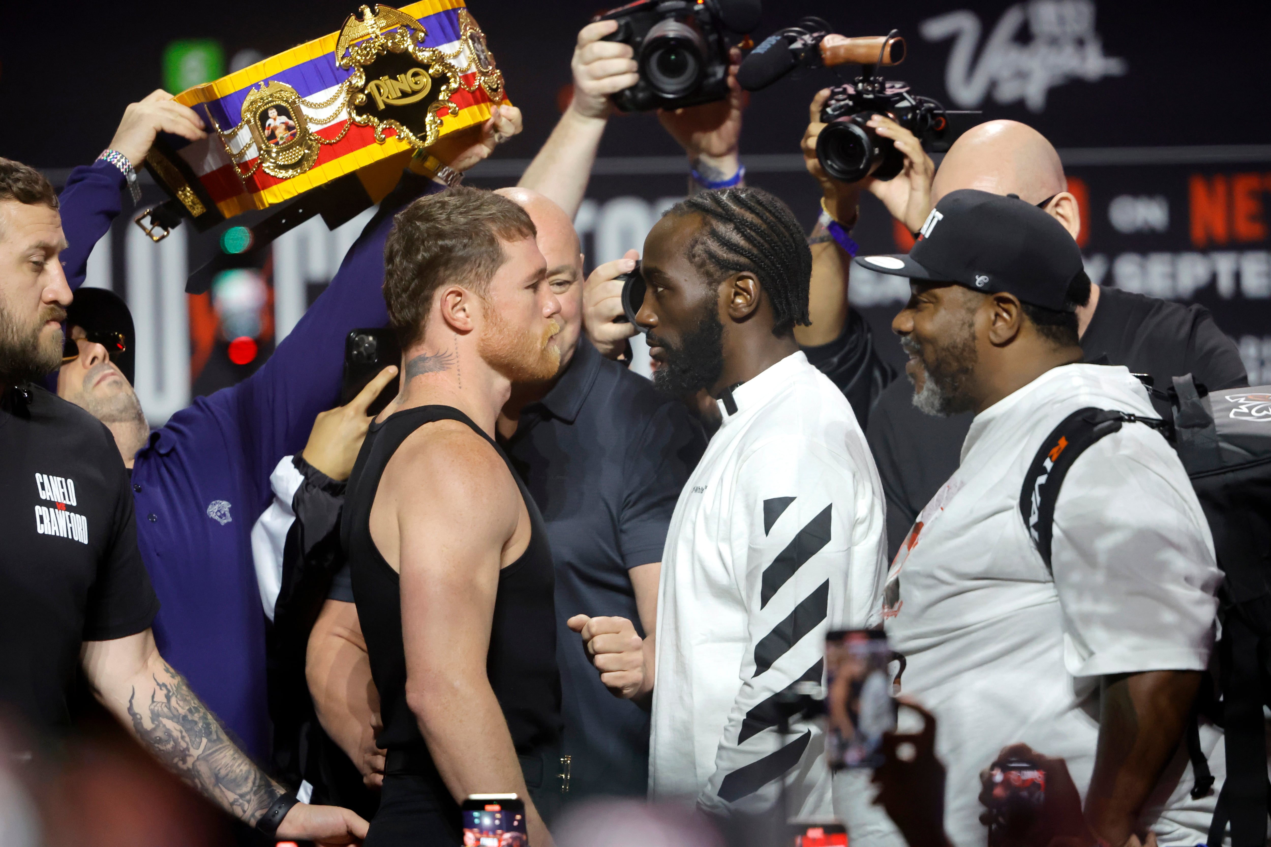 LAS VEGAS, NEVADA - SEPTEMBER 11: Undisputed super middleweight champion Canelo Alvarez (L) and Terence Crawford face off during a news conference at T-Mobile Arena on September 11, 2025 in Las Vegas, Nevada. Alvarez and Crawford are scheduled to fight on September 13, 2025, at Allegiant Stadium in Las Vegas. (Photo by Steve Marcus/Getty Images)