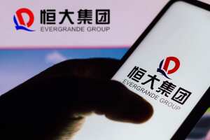 BRAZIL - 2021/09/22: In this photo illustration the Evergrande Group logo seen displayed on a smartphone. (Photo Illustration by Rafael Henrique/SOPA Images/LightRocket via Getty Images)
