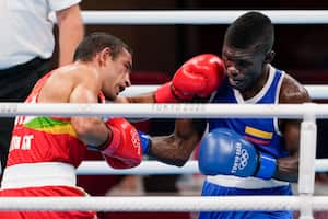 India's Amit Panghal, left, punches Colombia's Yuberjen Martínez during their men's flyweight 52-kg boxing match at the 2020 Summer Olympics, Saturday, July 31, 2021, in Tokyo, Japan. (AP Photo/Themba Hadebe)
