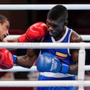 India's Amit Panghal, left, punches Colombia's Yuberjen Martínez during their men's flyweight 52-kg boxing match at the 2020 Summer Olympics, Saturday, July 31, 2021, in Tokyo, Japan. (AP Photo/Themba Hadebe)