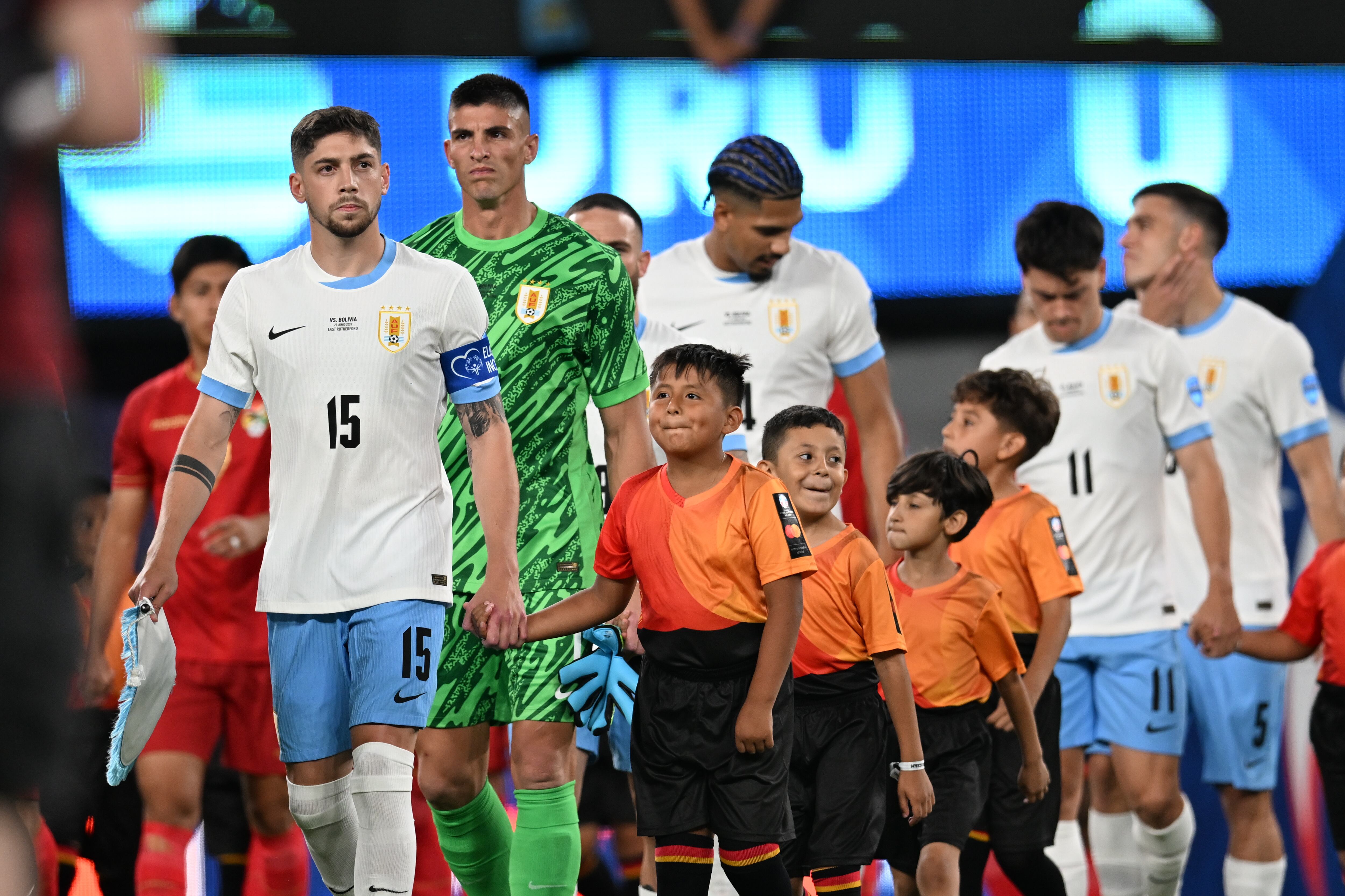 EAST RUTHERFORD, NEW JERSEY - JUNE 27: Federico Valverde #15, Sergio Rochet #1, Nahitan Nandez #8, Ronald Araujo #4, and Facundo Pellistri #11 of Uruguay enter the field before a Copa America 2024 Group C match between Bolivia and Uruguay at MetLife Stadium on June 27, 2024 in East Rutherford, New Jersey. (Photo by Stephen Nadler/ISI Photos/Getty Images)