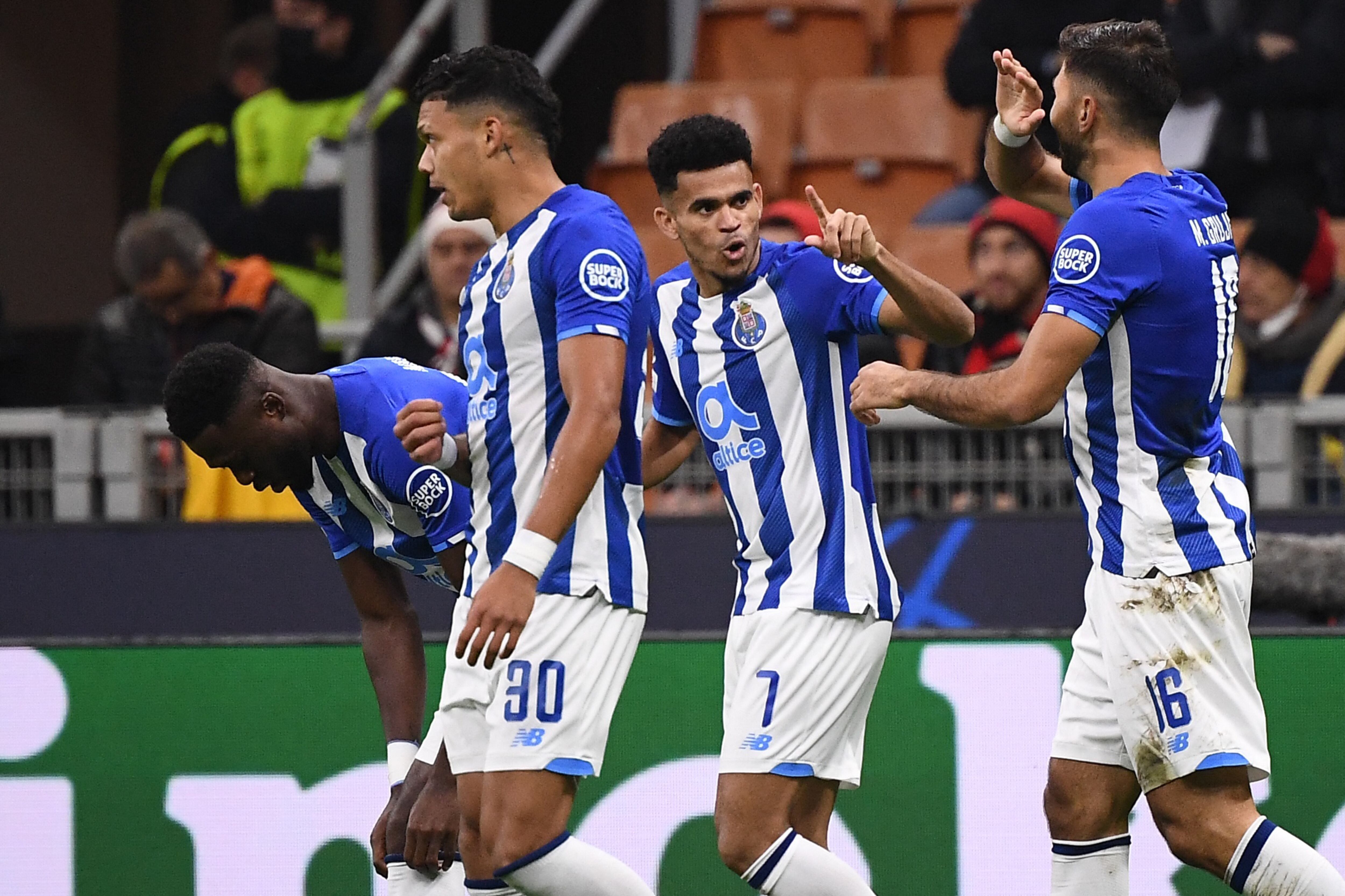 FC Porto's Colombian forward Luis Diaz celebrates after opening the scoring during the UEFA Champions League Group B football match between AC Milan and Porto on November 3, 2021 at the San Siro stadium in Milan. (Photo by Marco BERTORELLO / AFP)