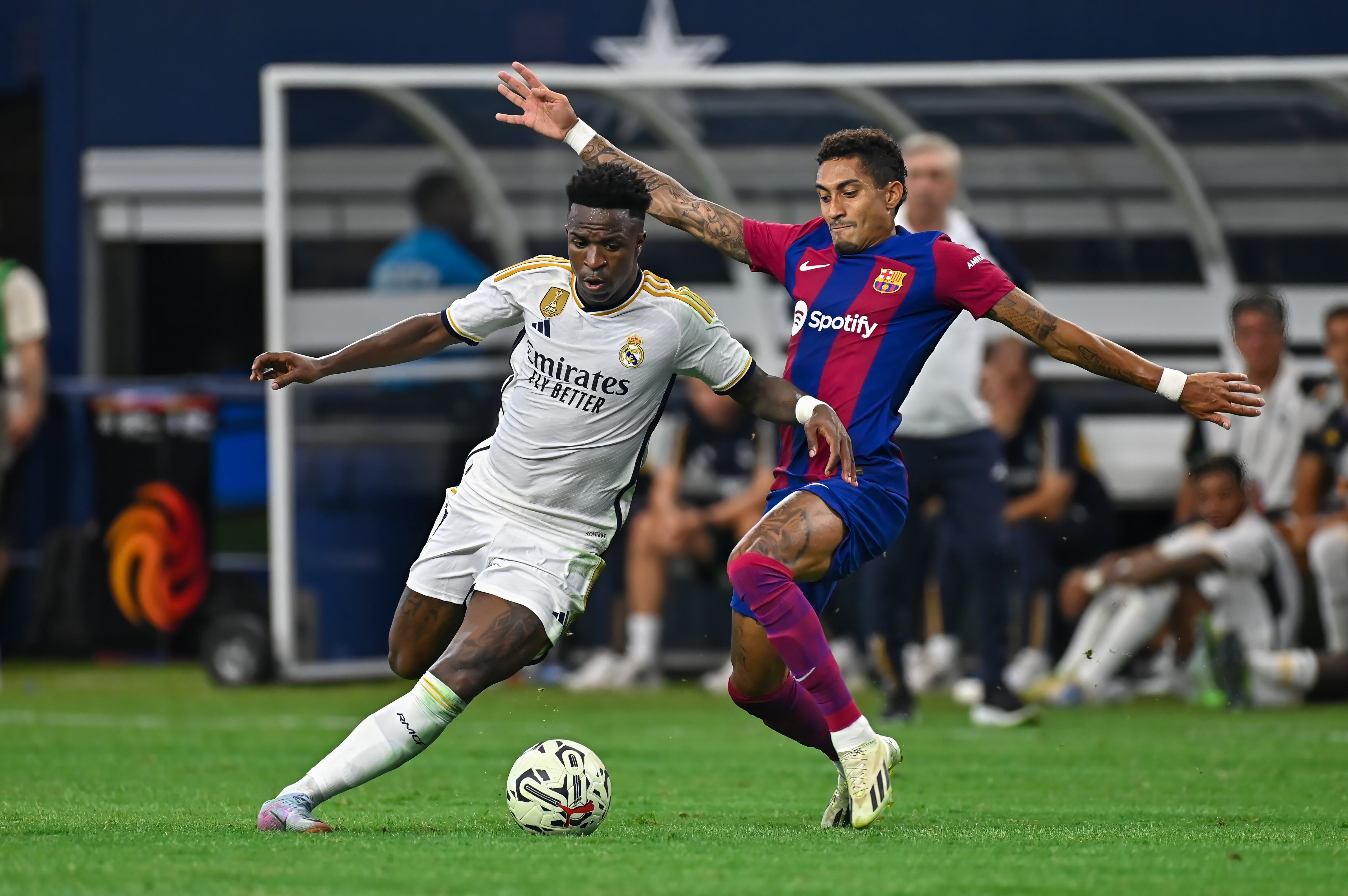 ARLINGTON, TX - JULY 29: Real Madrid forward, Vinicius Junior (7), and Barcelona forward, Raphinha (22), work for ball control during the International Men's Soccer match between Real Madrid and FC Barcelona on July 29, 2023; at AT&T Stadium in Arlington, TX. (Photo by Kevin Langley/Icon Sportswire via Getty Images)