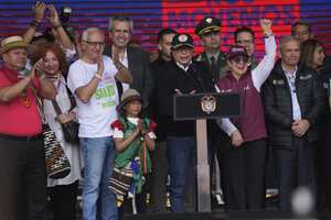 Colombia's President Gustavo Petro, center, delivers a speech at the Bolivar square after a march to support his proposed reforms, in Bogota, Colombia, Wednesday, Sept. 27, 2023. (AP Photo/Fernando Vergara)