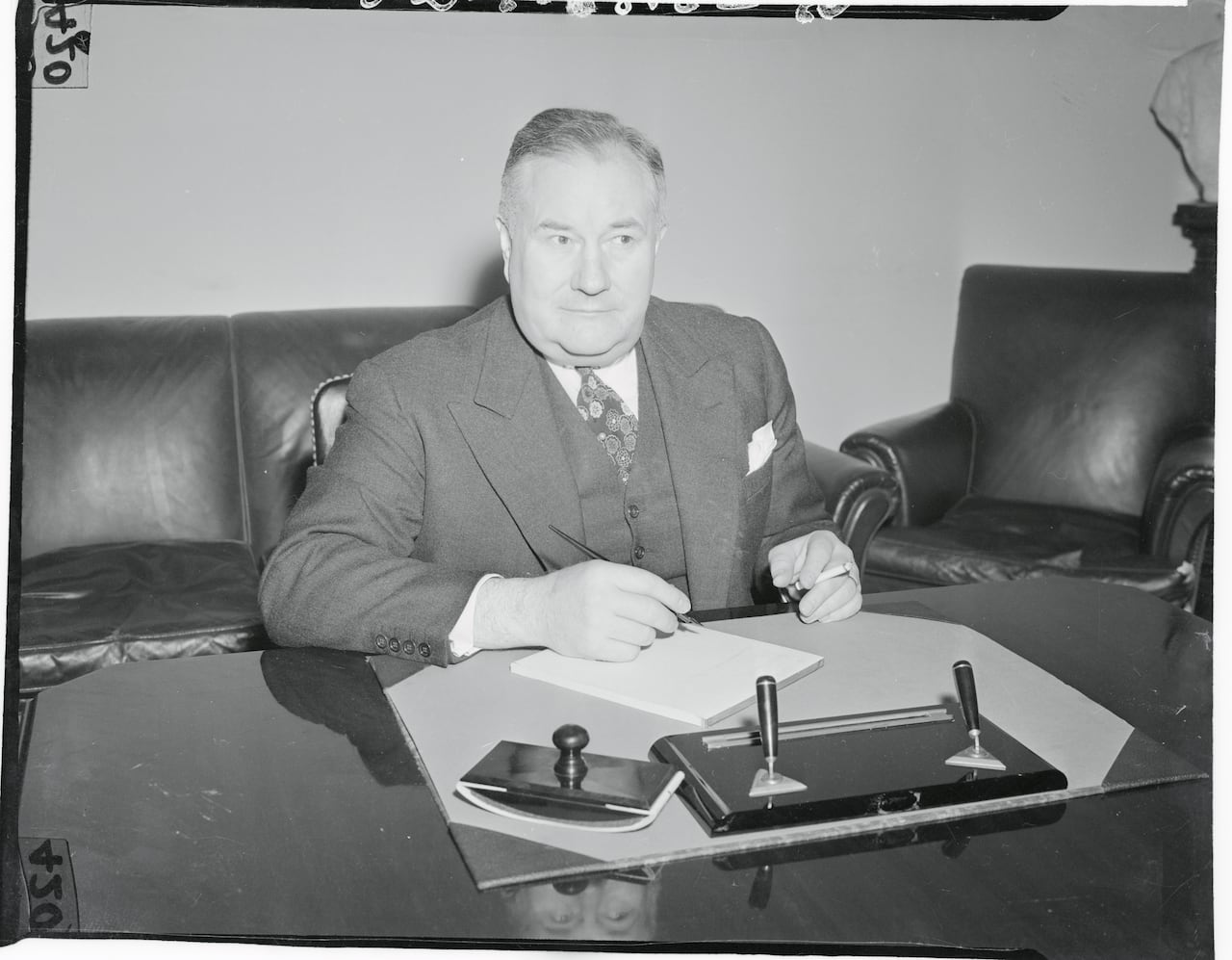 (Original Caption) Washington: Desk picture of the new Asst. Sect. of state Spruille Braden, sworn-in today at the state Department.