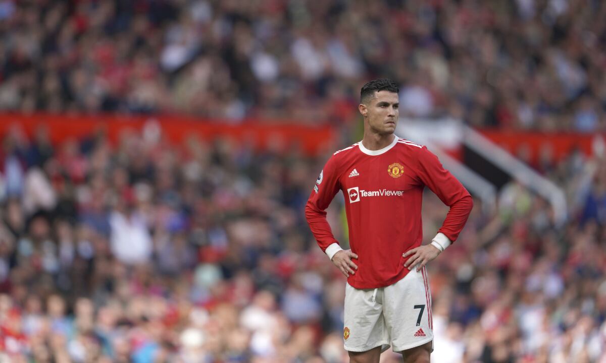 Manchester United's Cristiano Ronaldo stands on the pitch during the English Premier League soccer match between Manchester United and Norwich City at Old Trafford stadium in Manchester, England, Saturday, April 16, 2022. (AP/Jon Super)
