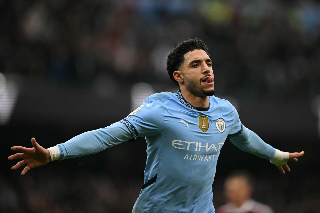 Manchester City's Egyptian striker #07 Omar Marmoush celebrates after scoring the opening goal during the English Premier League football match between Manchester City and Newcastle United at the Etihad Stadium in Manchester, north west England, on February 15, 2025. (Photo by Oli SCARFF / AFP) / RESTRICTED TO EDITORIAL USE. No use with unauthorized audio, video, data, fixture lists, club/league logos or 'live' services. Online in-match use limited to 120 images. An additional 40 images may be used in extra time. No video emulation. Social media in-match use limited to 120 images. An additional 40 images may be used in extra time. No use in betting publications, games or single club/league/player publications. /
