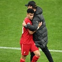 PARIS, FRANCE - MAY 28: Luis Diaz embraces Juergen Klopp, Manager of Liverpool after they are substituted during the UEFA Champions League final match between Liverpool FC and Real Madrid at Stade de France on May 28, 2022 in Paris, France. (Photo by Matthias Hangst/Getty Images)