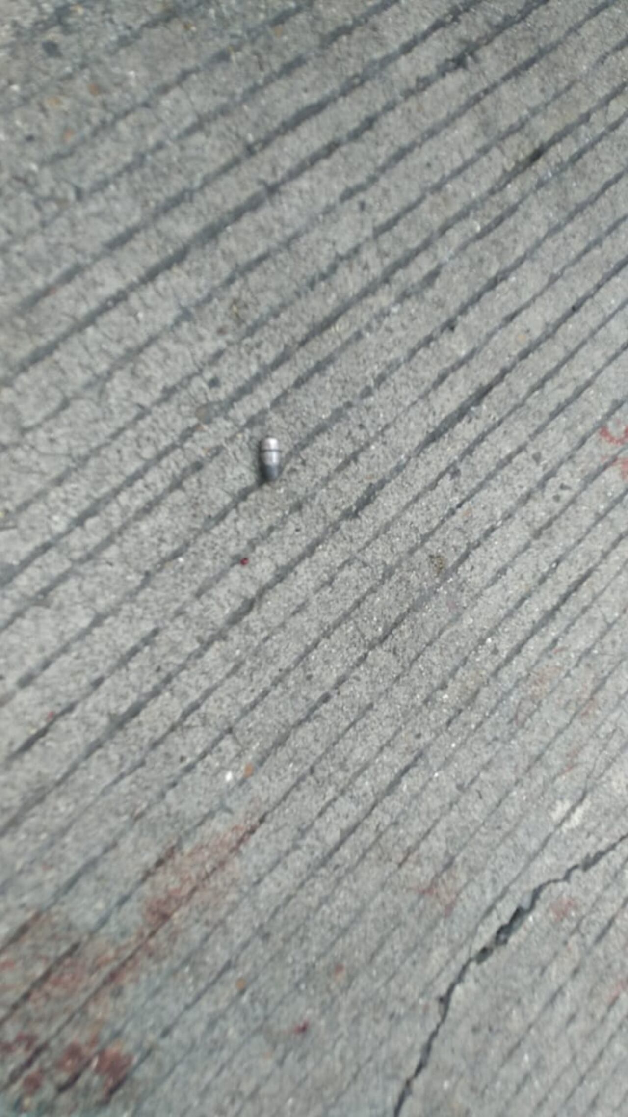 Una de las balas que cayeron en el lugar del crimen.