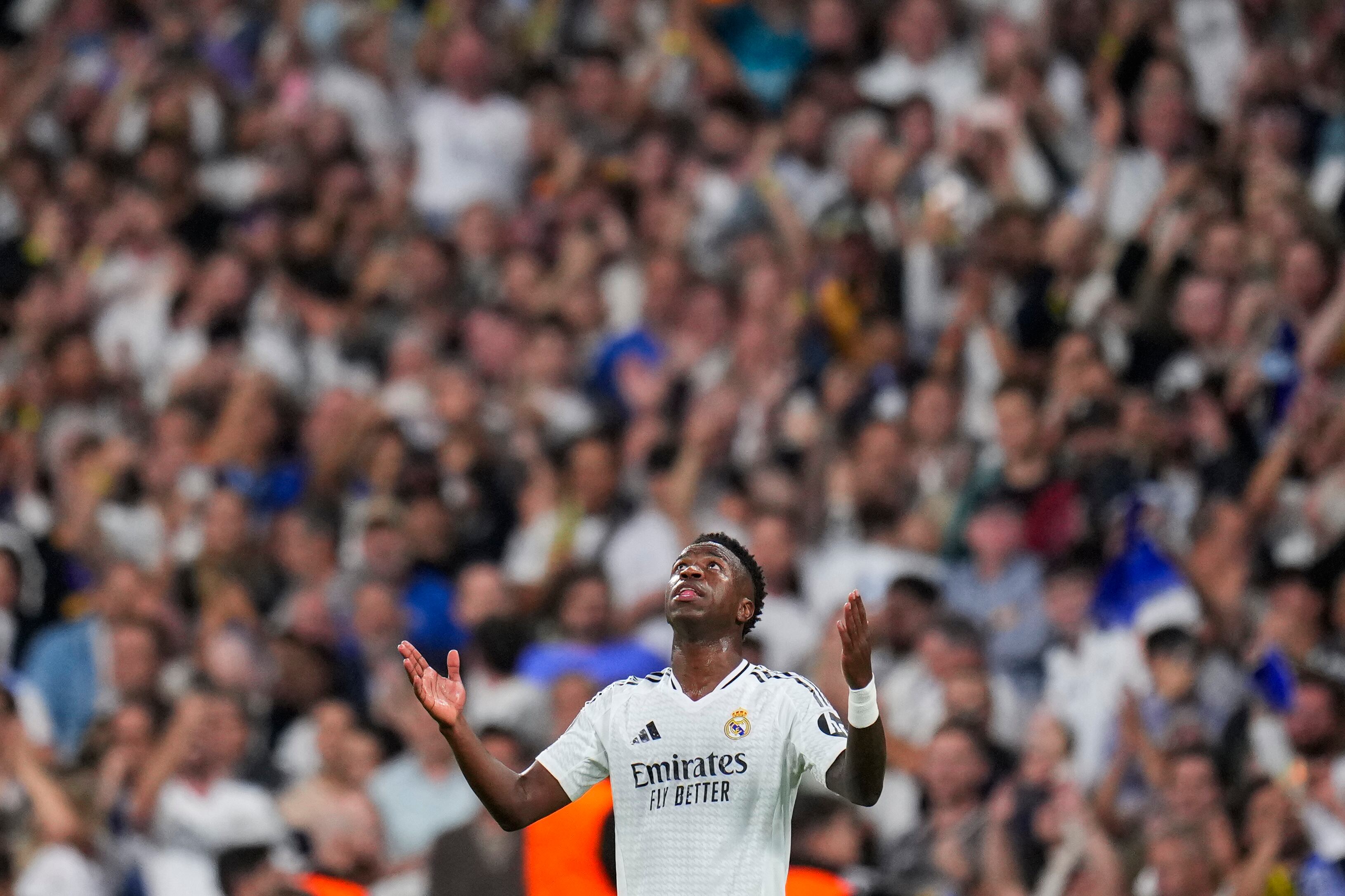Real Madrid's Vinicius Junior celebrates after scoring his side's second goal during the Champions League opening phase soccer match between Real Madrid and Borussia Dortmund at the Santiago Bernabeu stadium in Madrid, Tuesday, Oct. 22, 2024. (AP Photo/Manu Fernandez)