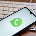 SPAIN - 2022/04/25: In this photo illustration, a WhatsApp logo seen displayed on a smartphone on top of a computer keyboard. (Photo Illustration by Thiago Prudencio/SOPA Images/LightRocket via Getty Images)