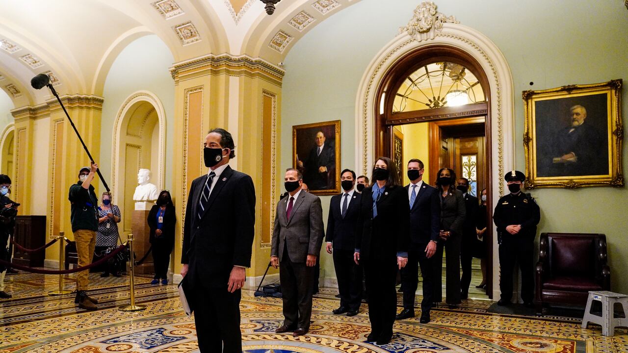 Democratic House impeachment managers stand after delivering the article of impeachment to the Senate alleging incitement of insurrection against former President Donald Trump, in Washington, Monday, Jan. 25, 2021. (Melina Mara/The Washington Post via AP, Pool)