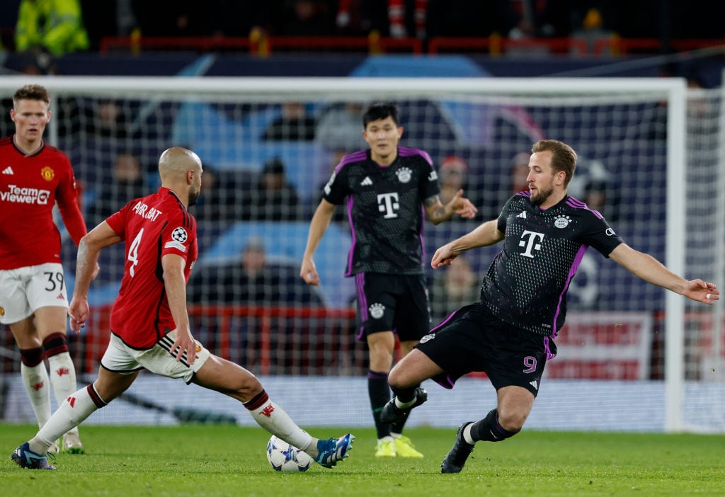 MANCHESTER, ENGLAND - DECEMBER 12: Sofyan Amrabat of Manchester United and Harry Kane of Bayern Munich challenge during the UEFA Champions League match between Manchester United and FC Bayern Munchen at Old Trafford on December 12, 2023 in Manchester, England. (Photo by Richard Sellers/Sportsphoto/Allstar via Getty Images)