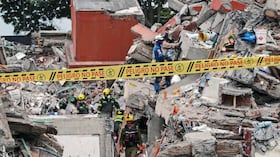Caution tape cordons off a building collapsed by the earthquake in Cali, Colombia, Sunday, Aug. 16, 2026. (AP Photo/Santiago Saldarriaga)