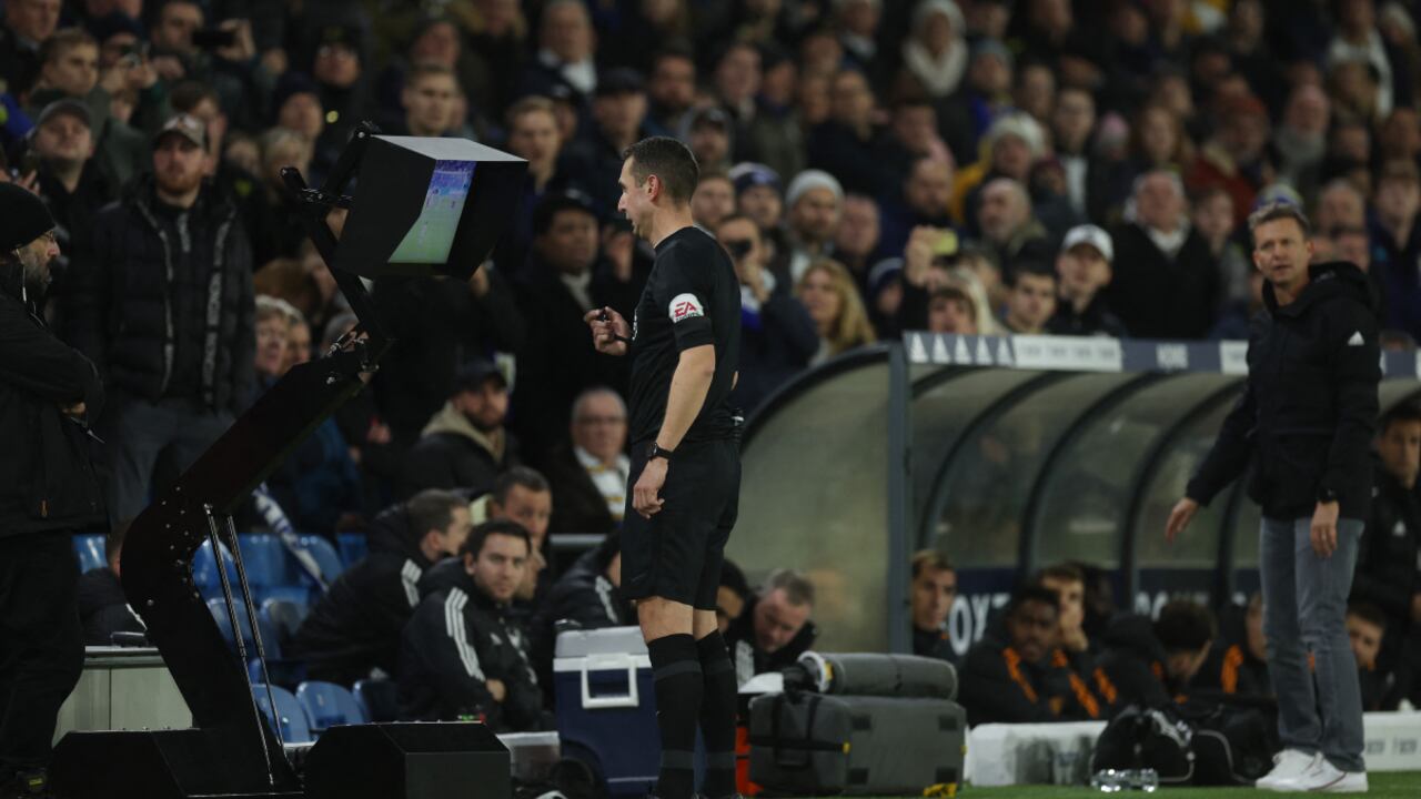 Soccer Football - Premier League - Leeds United v West Ham United - Elland Road, Leeds, Britain - January 4, 2023 Referee David Coote looks at the VAR monitor before awarding West Ham United a penalty Action Images via Reuters/Lee Smith EDITORIAL USE ONLY. No use with unauthorized audio, video, data, fixture lists, club/league logos or 'live' services. Online in-match use limited to 75 images, no video emulation. No use in betting, games or single club /league/player publications. Please contact your account representative for further details.