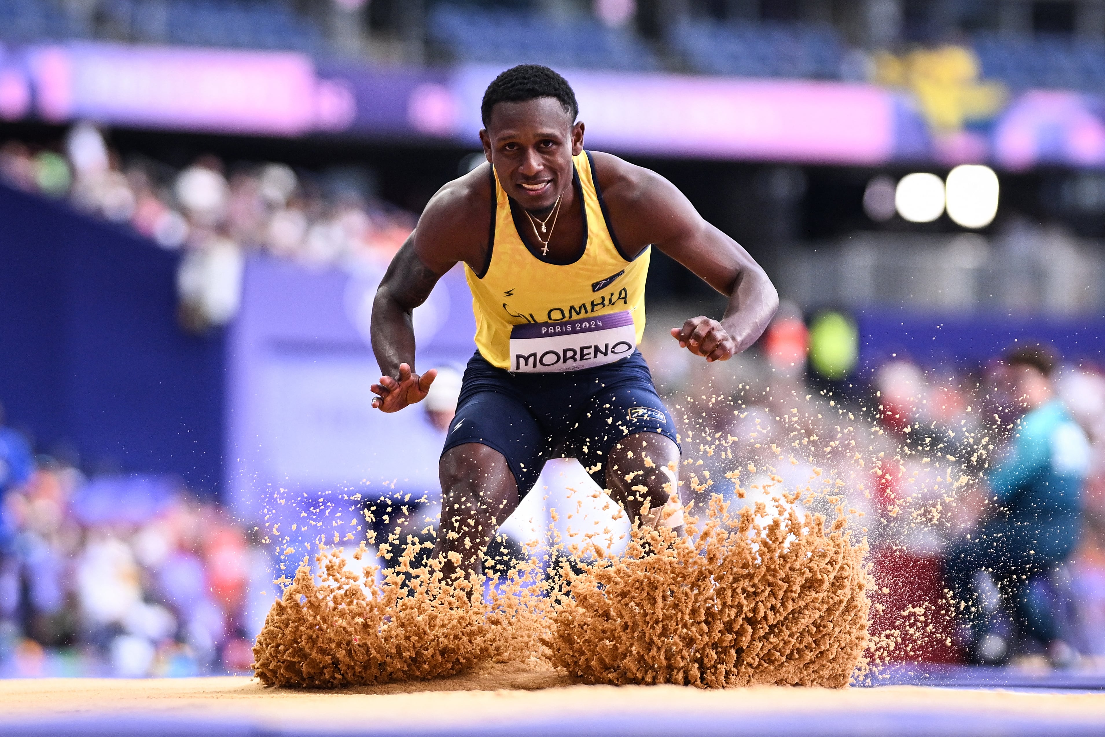 Colombia's Geiner Moreno competes in the men's triple jump qualification of the athletics event at the Paris 2024 Olympic Games at Stade de France in Saint-Denis, north of Paris, on August 7, 2024. (Photo by Kirill KUDRYAVTSEV / AFP)