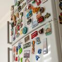 Lots of various souvenir magnets on the fridge in the kitchen