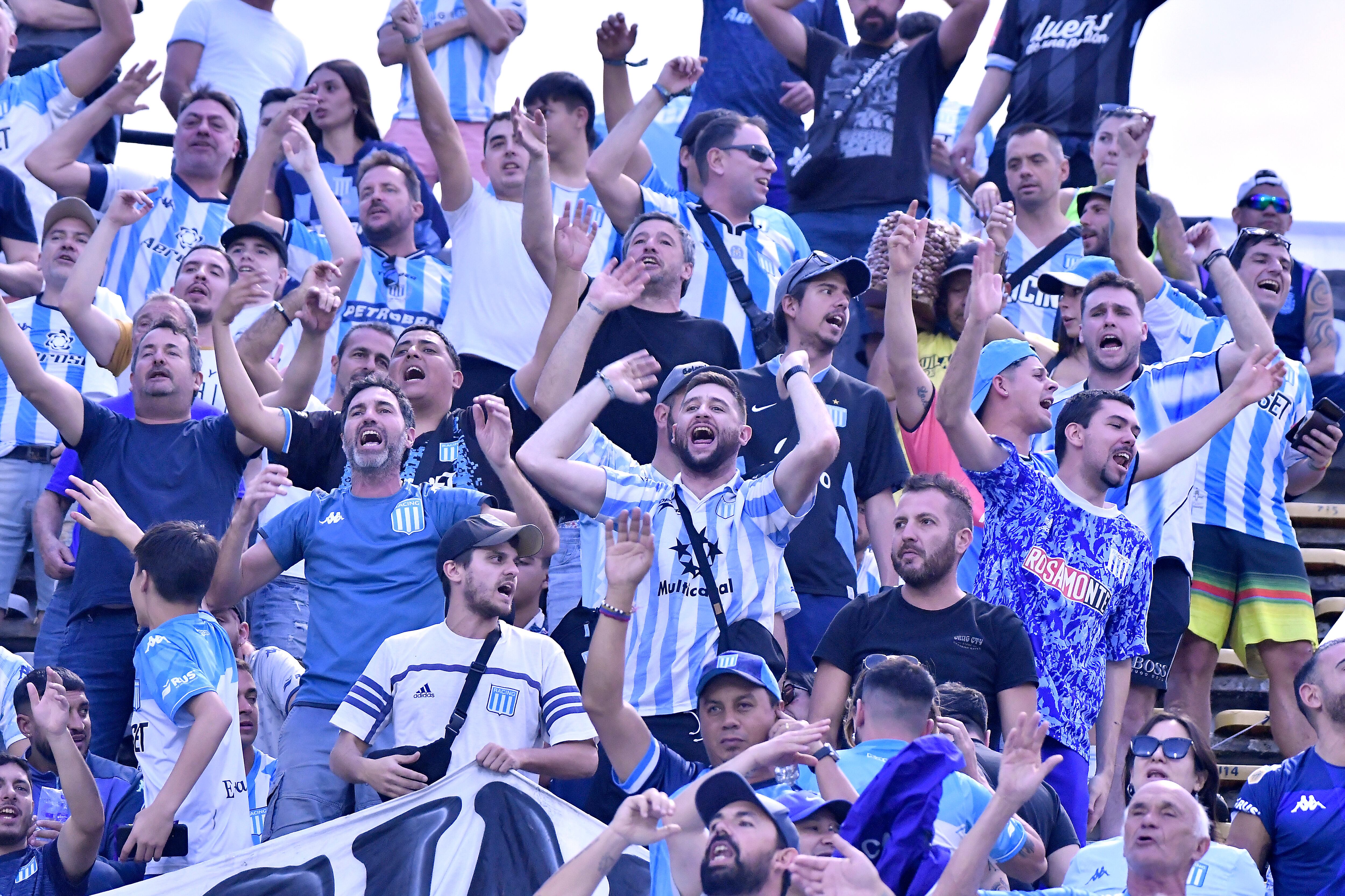 MEDELLIN, COLOMBIA - AUGUST 03: Fans of Racing Club cheer on their team prior to a Copa CONMEBOL Libertadores 2023 round of sixteen first leg match between Atletico Nacional and Racing Club at Estadio Atanasio Girardot on August 03, 2023 in Medellin, Colombia. (Photo by Gabriel Aponte/Getty Images)