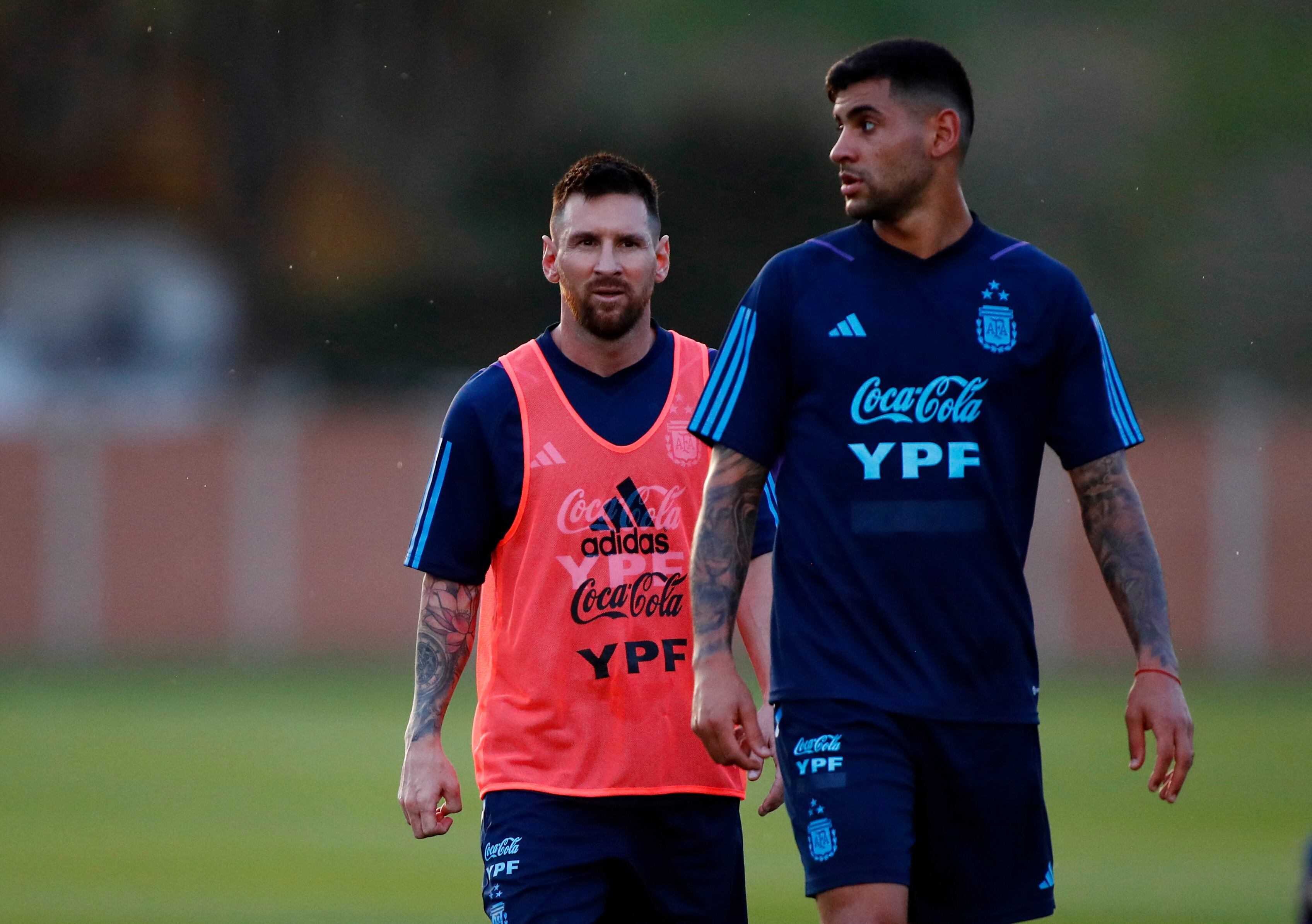 Soccer Football - World Cup - South American Qualifiers - Argentina training - Lionel Andres Messi Training Ground, Buenos Aires, Argentina - October 10, 2023 Argentina's Lionel Messi with Cristian Romero during training REUTERS/Agustin Marcarian